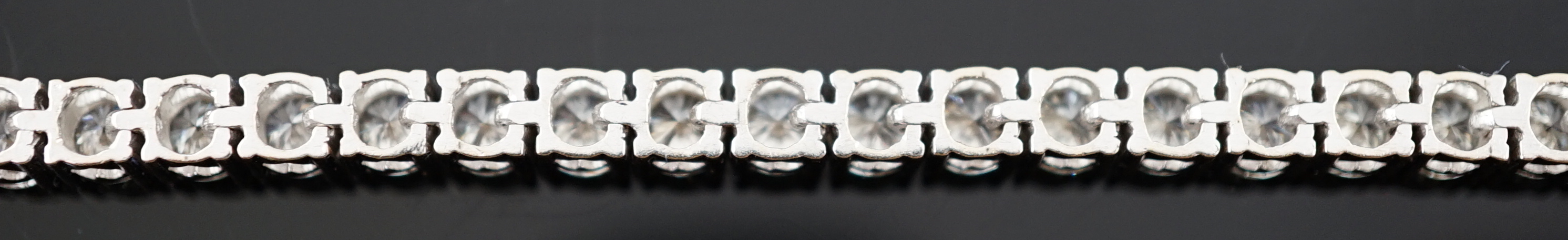 An 18k white gold and diamond line bracelet